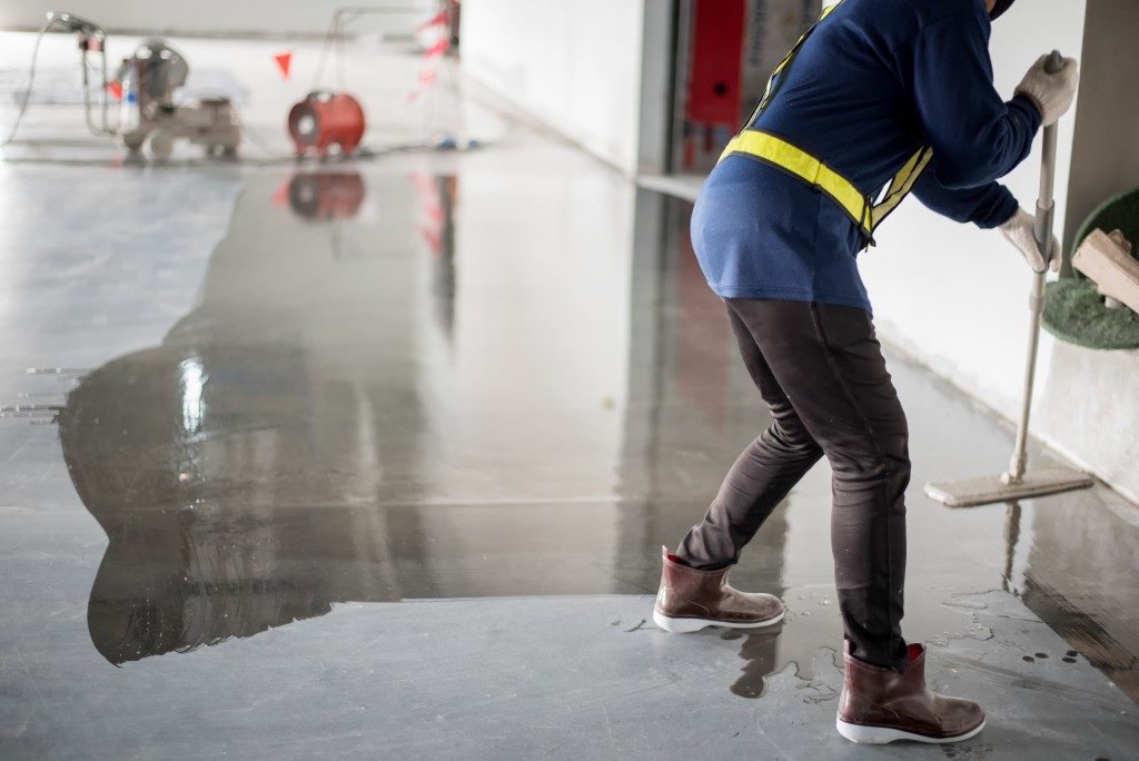 cleaning concrete floors of a building