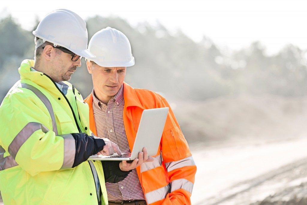 construction officers looking at documents