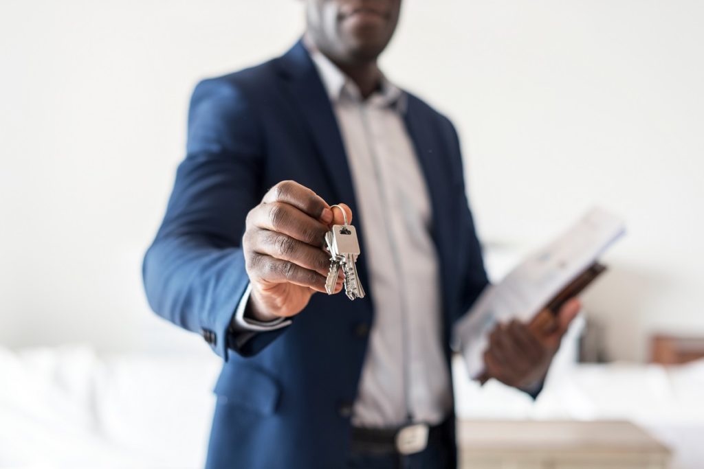 Realtor handing over property keys