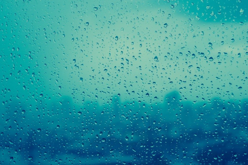 Rain drops, water drops of rain on a window glass