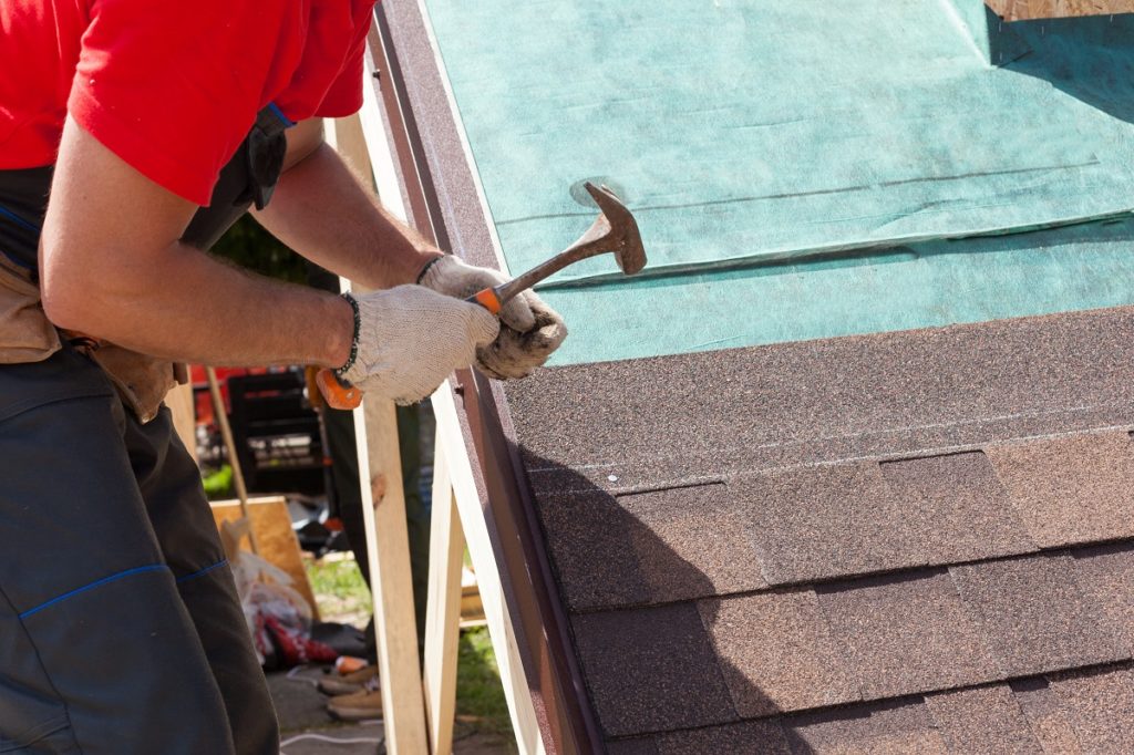 Man fixing the roof