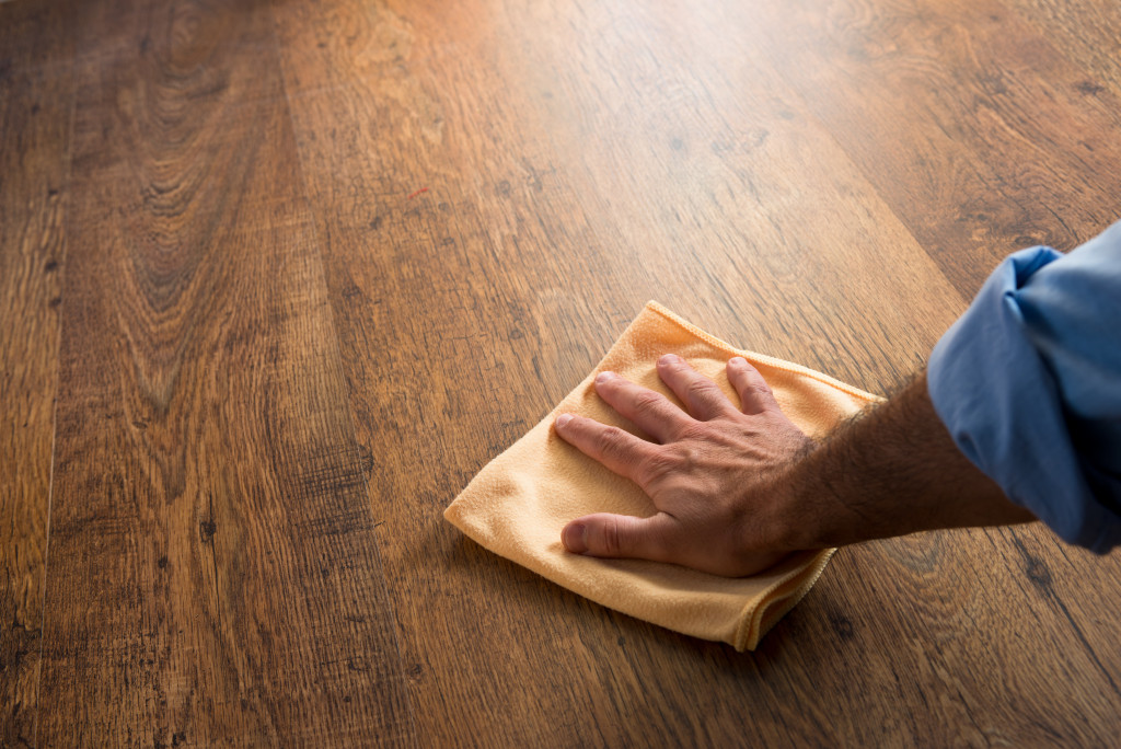 wiping a wooden surface