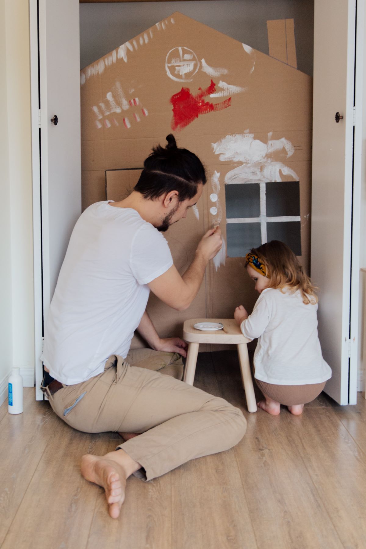 man and daughter playing together