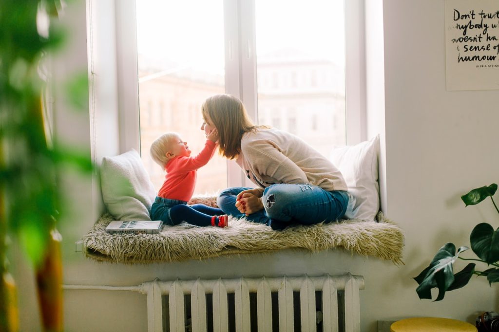 child playing with mom