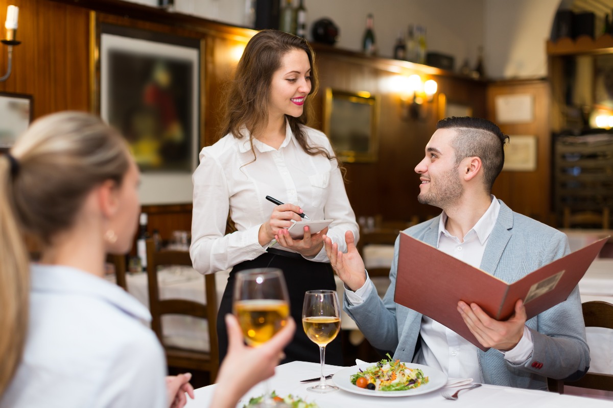 restaurant customers with a waitress