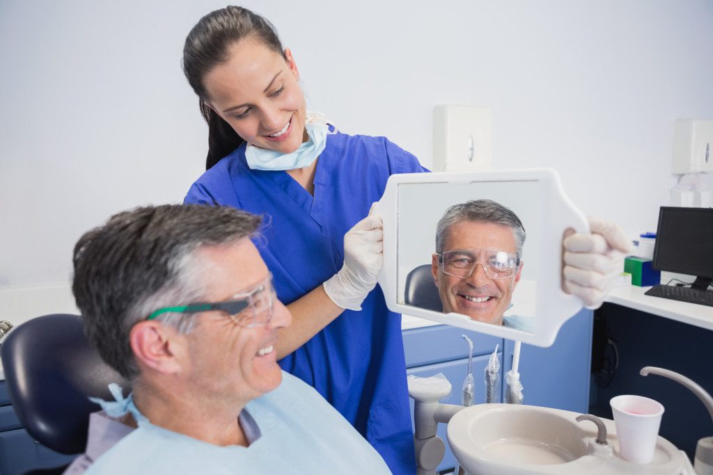 man smiling in the mirror