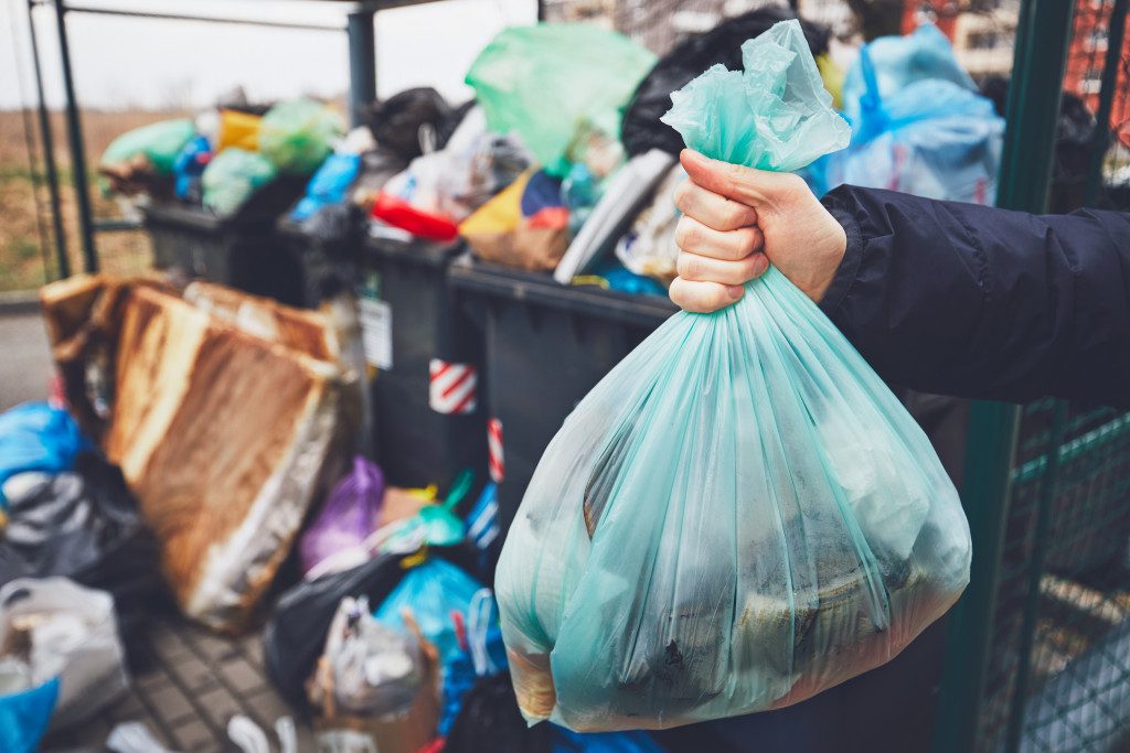 a person throwing out garbage