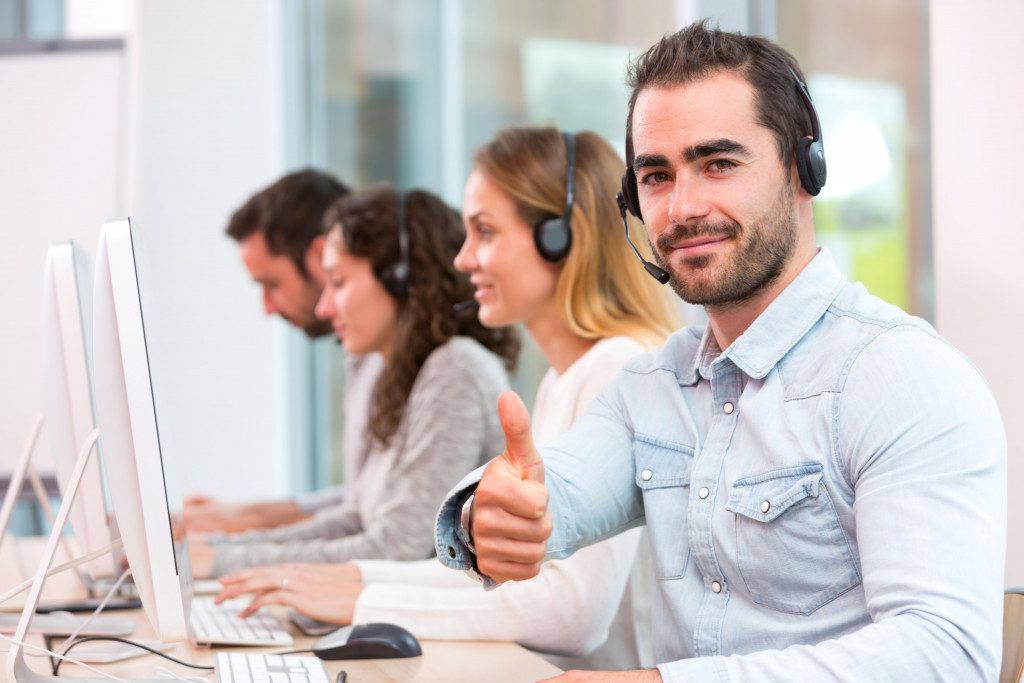 Employees working with their headphones on