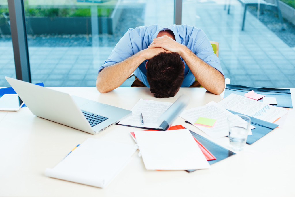 male stressed with overloaded work