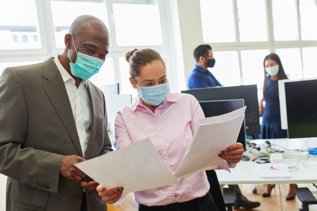 employees wearing face masks in the office