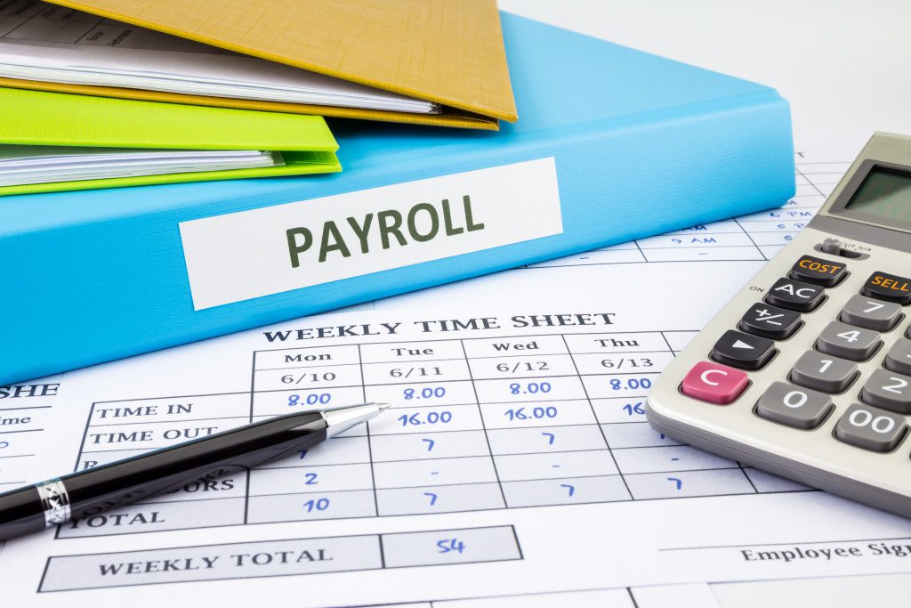 a portrait of a payroll document with employee time records