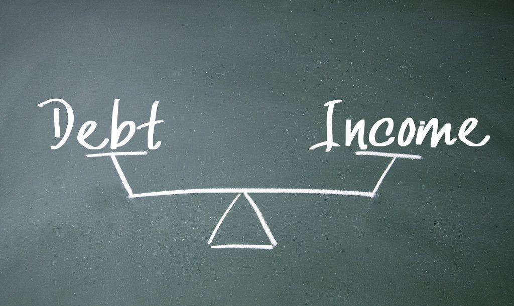 debt and income balance sign