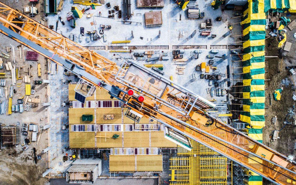 big residential construction site with many people and equipment