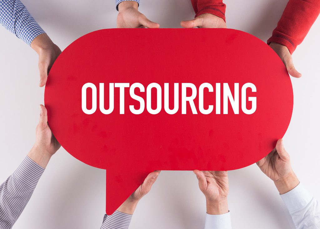 Outsourcing written on a red speech box